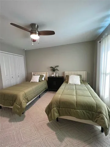 a bedroom with a bed and window