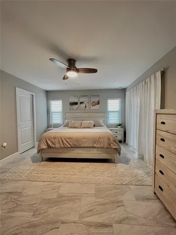 a bedroom with a bed and a dresser