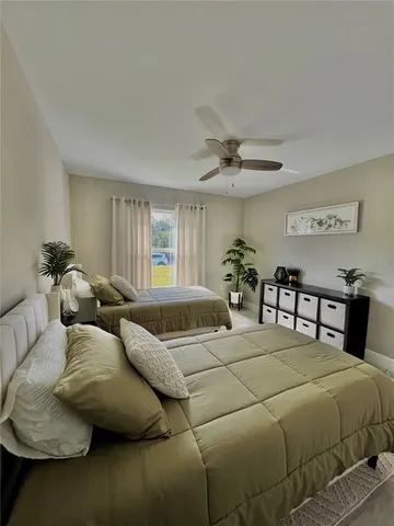 a bedroom with a bed and window