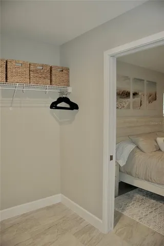 a bedroom with a bed and a walk in closet