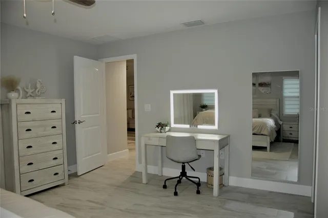 a workspace with furniture and wooden floor