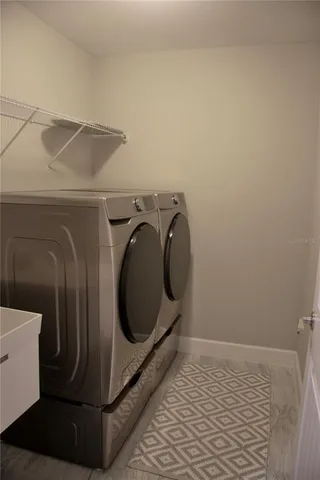 a utility room with dryer and washer