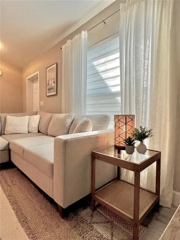 a living room with furniture and a window