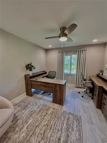 a bedroom with furniture and a wooden floor