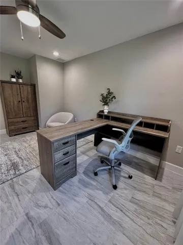 a view of a workspace with furniture