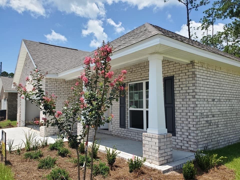 170 Conner Circle Santa Rosa Beach, FL 32459 - Photo 1 of 44 a front view of a house with a garden