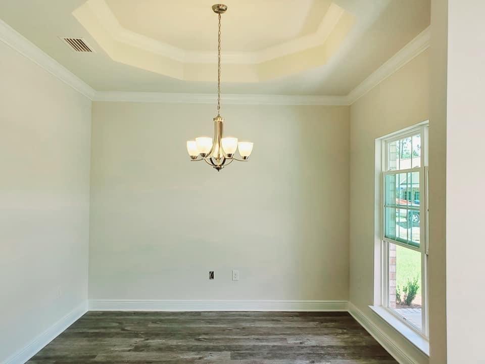 170 Conner Circle Santa Rosa Beach, FL 32459 - Photo 2 of 44 a view of empty room with wooden floor and fan