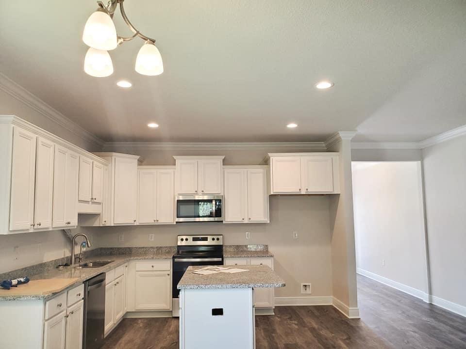 170 Conner Circle Santa Rosa Beach, FL 32459 - Photo 3 of 44 a kitchen with stainless steel appliances a sink a stove a refrigerator and cabinets
