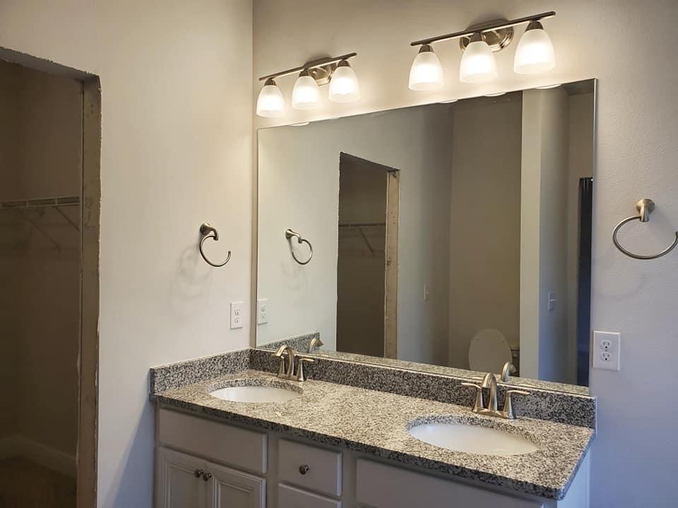 170 Conner Circle Santa Rosa Beach, FL 32459 - Photo 5 of 44 a bathroom with a granite countertop sink and a mirror
