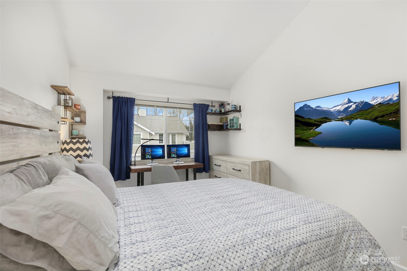 1522 196th Street Southeast, Unit G101 Bothell, WA 98012 - Photo 17 of 29 a bedroom with a large bed and a large window