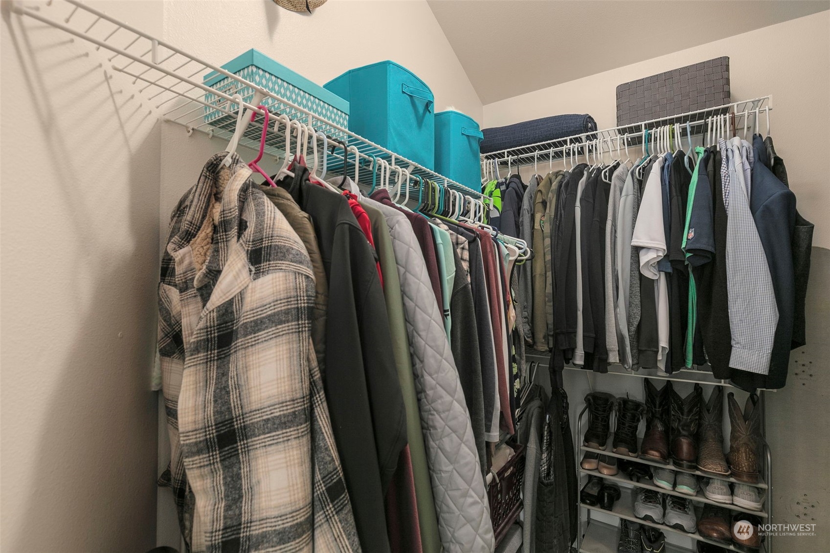 1522 196th Street Southeast, Unit G101 Bothell, WA 98012 - Photo 23 of 29 a view of walk in closet with clothes and shoes