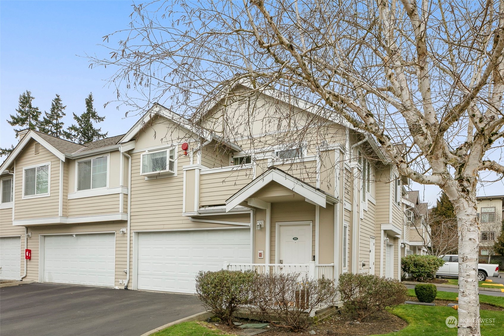 1522 196th Street Southeast, Unit G101 Bothell, WA 98012 - Photo 25 of 29 a front view of a house with a yard