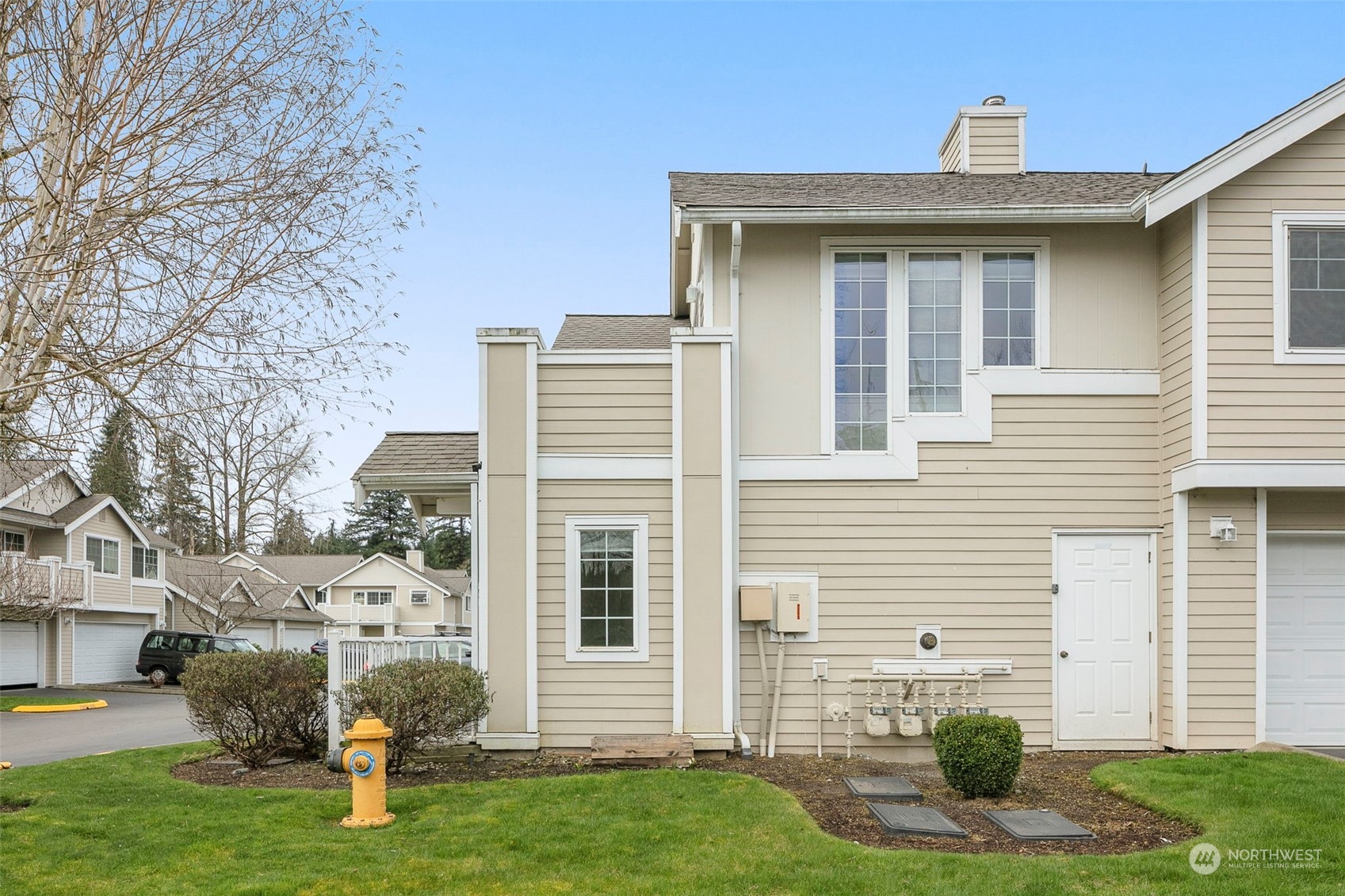 1522 196th Street Southeast, Unit G101 Bothell, WA 98012 - Photo 26 of 29 a view of a house with a yard