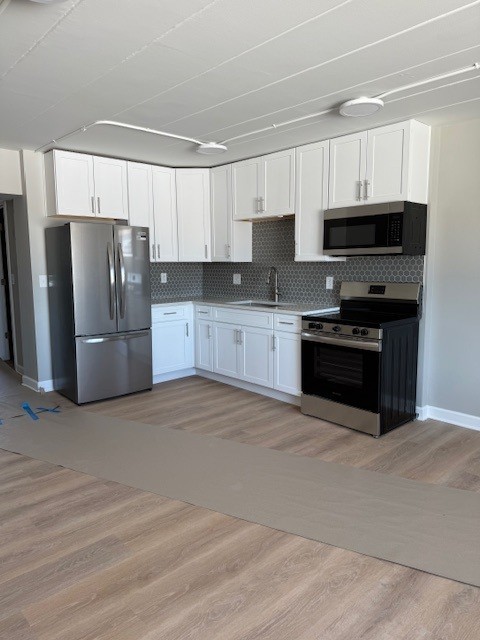 29837 Highway 50, Unit 39A Peotone, IL 60468 - Photo 2 of 13 a large kitchen with cabinets and stainless steel appliances