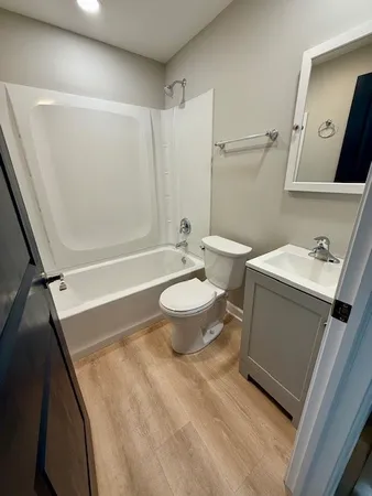 a bathroom with a toilet and a shower