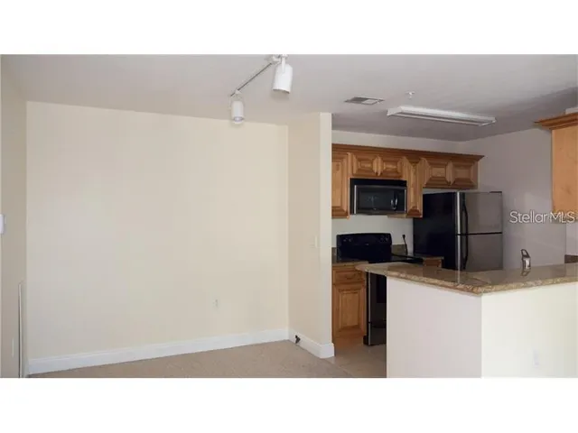 a black and white photo of a kitchen