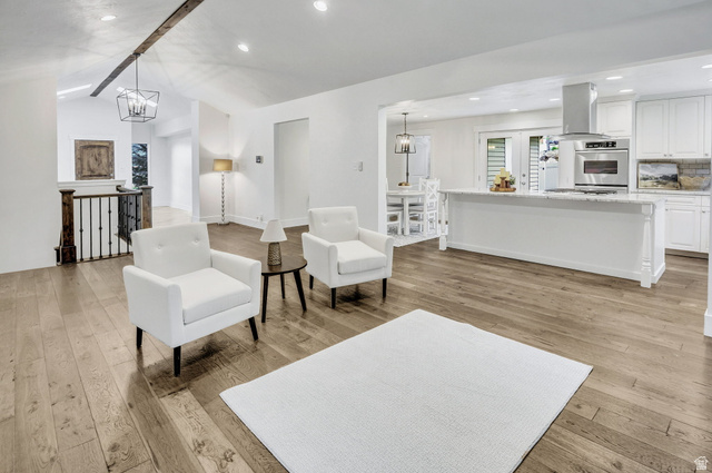 1320 Canyon Park Road Bountiful, UT 84010 - Photo 6 of 28 Living area featuring hanging lights, light wood-style floors, and an upstairs landing