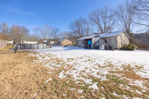 a view of snow on the side of the road