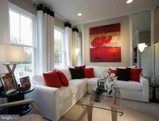 9860 Garden Ranges Laurel, MD 20723 - Photo 3 of 10 a living room with furniture and a flat screen tv