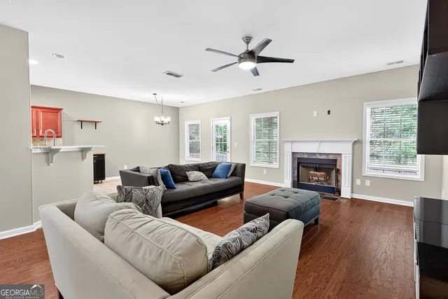 a living room with furniture and a fireplace