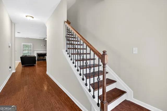 a view of entryway and hall with wooden floor