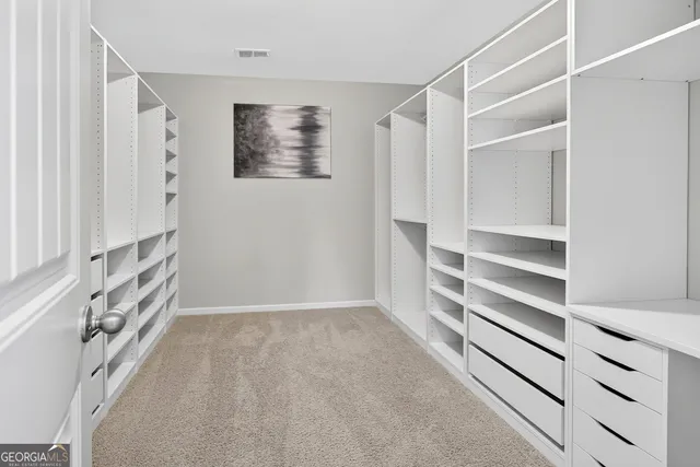 a view of an empty walk in closet