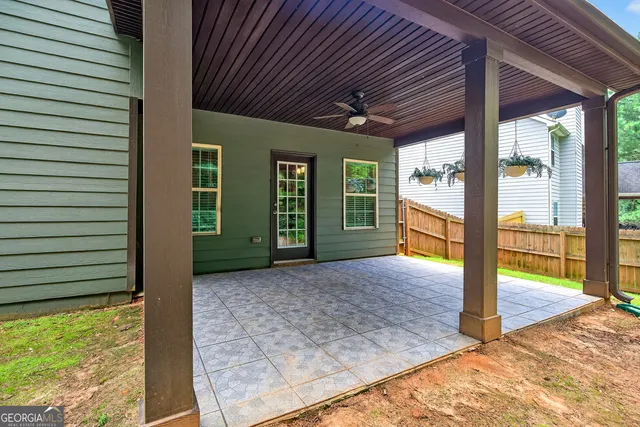 a view of backyard with porch