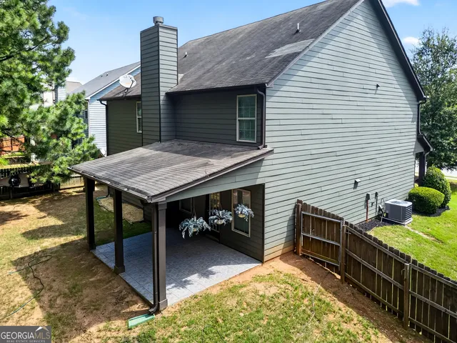 a roof deck with a table and chairs
