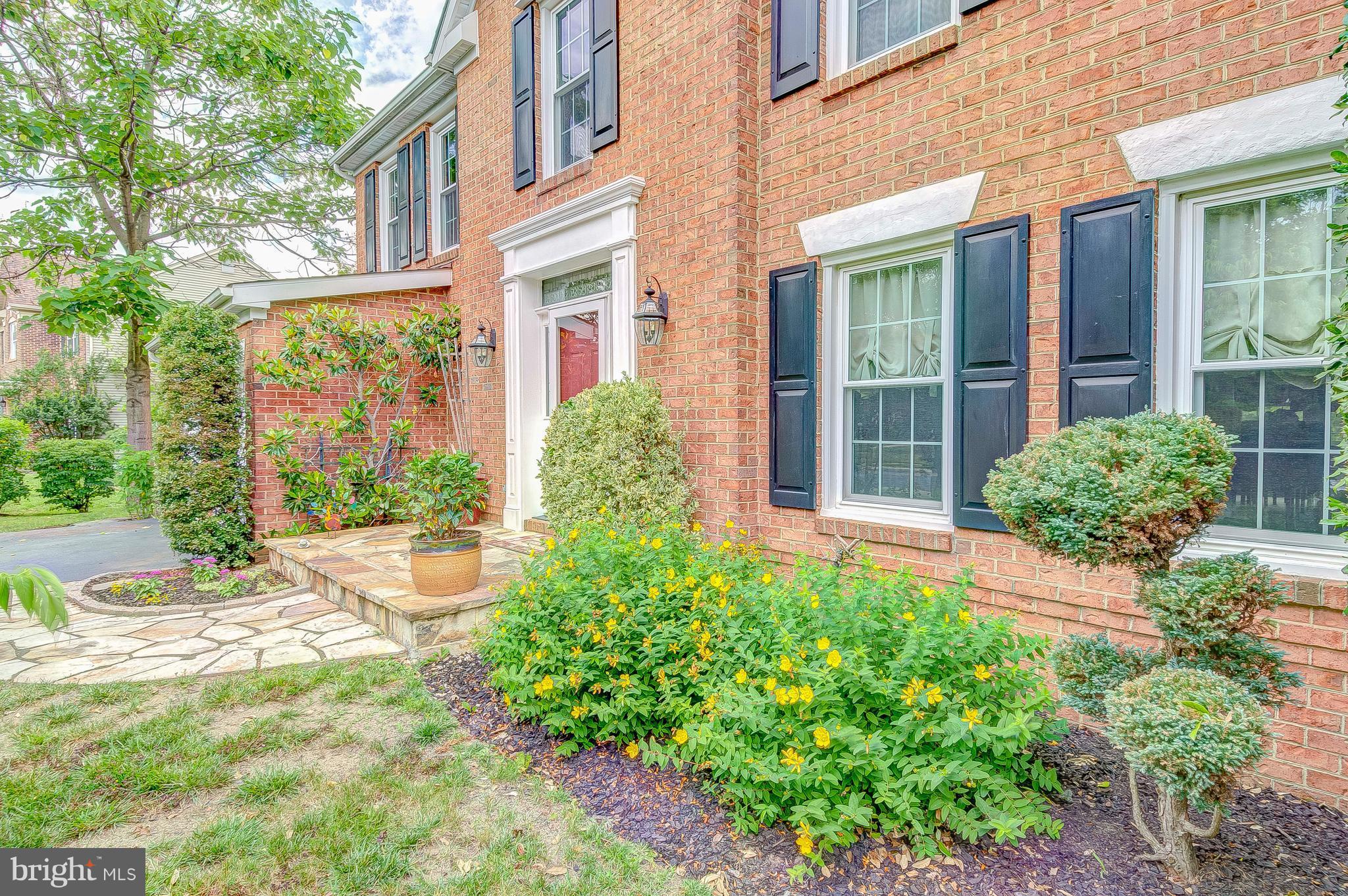 3222 Breckenridge Way Riva, MD 21140 - Photo 3 of 29 front view of a brick house with a large windows and a yard