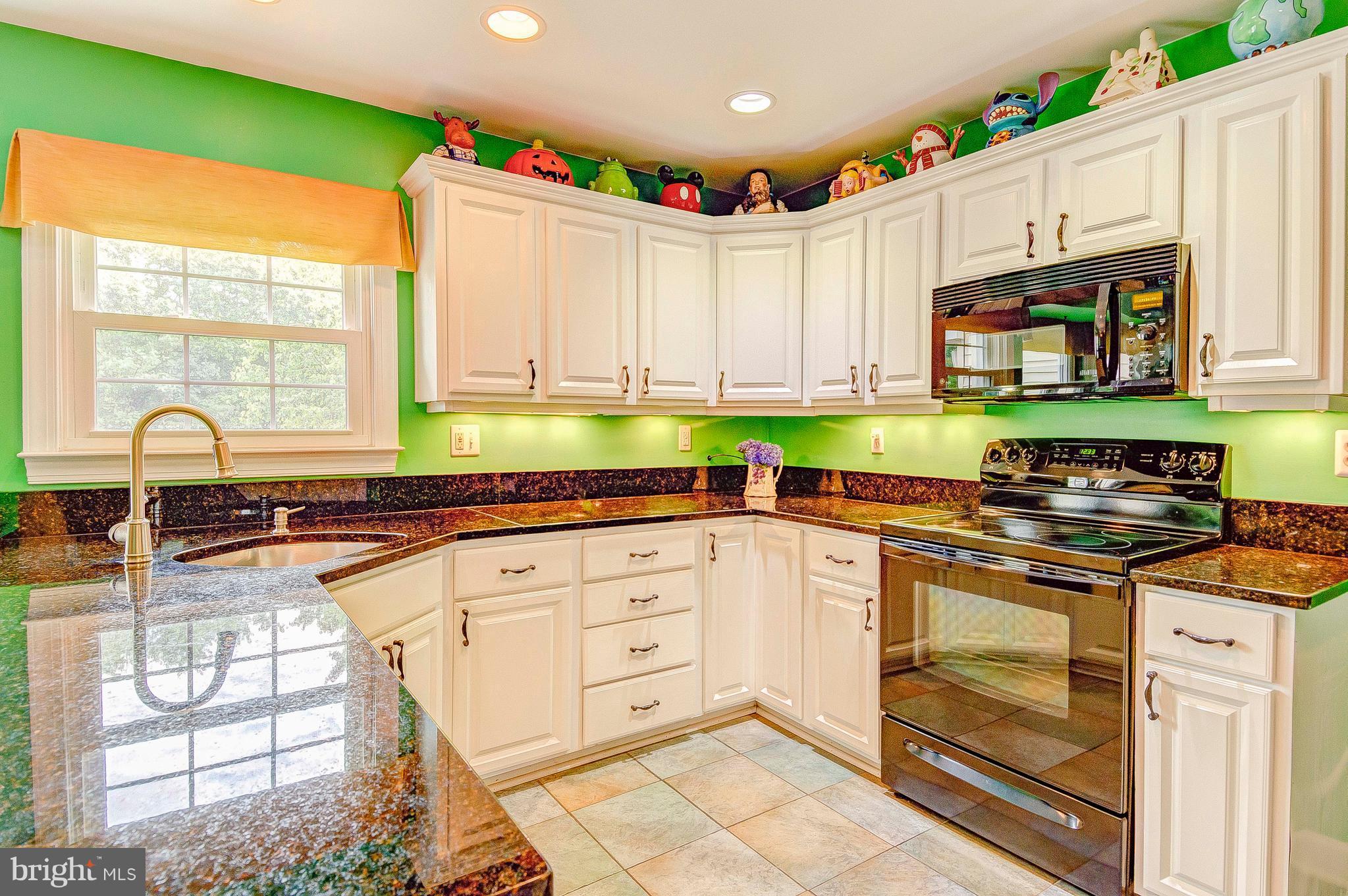 3222 Breckenridge Way Riva, MD 21140 - Photo 24 of 29 a kitchen with granite countertop a stove a sink and a microwave