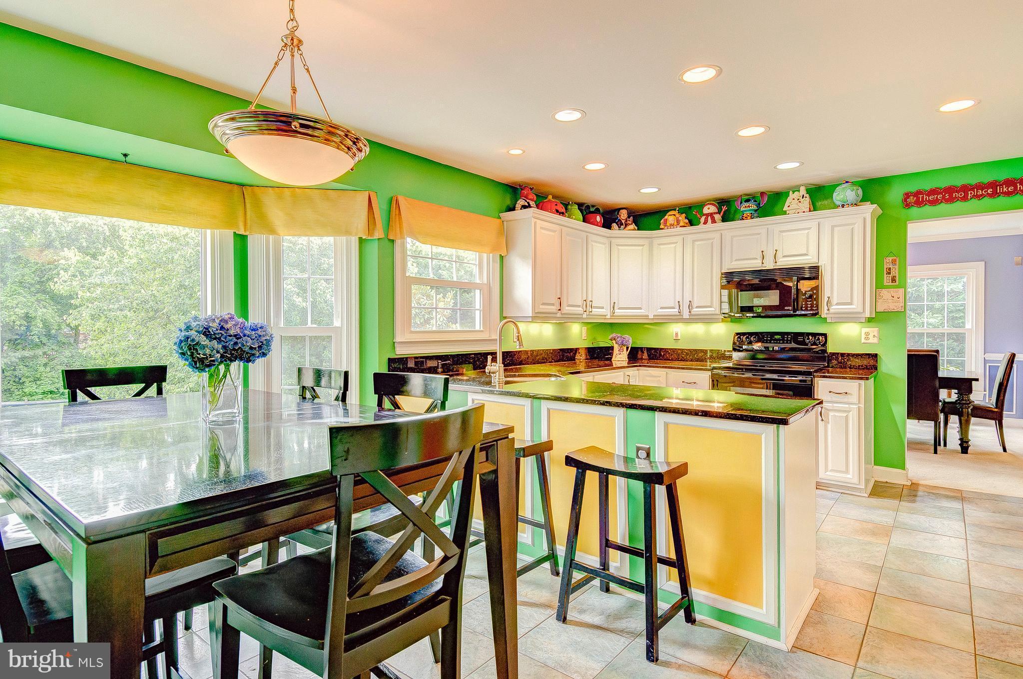 3222 Breckenridge Way Riva, MD 21140 - Photo 26 of 29 a kitchen with stainless steel appliances a table and chairs in it