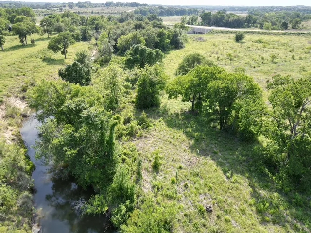 a view of lake with green space