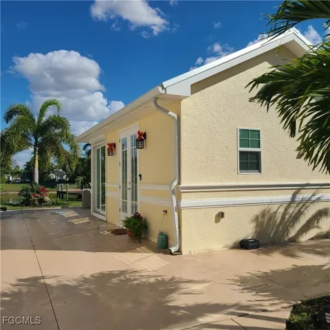 a view of a house with a snow on the road