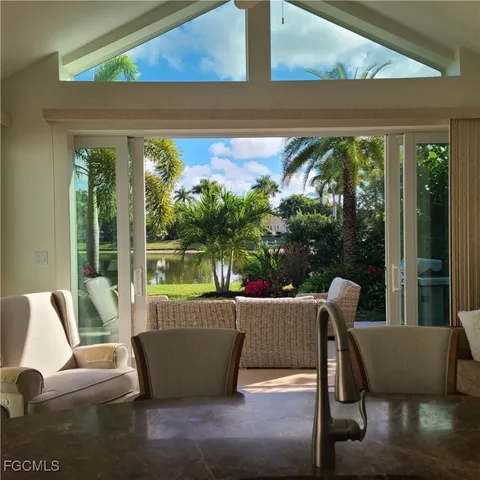 a view of balcony with furniture and garden