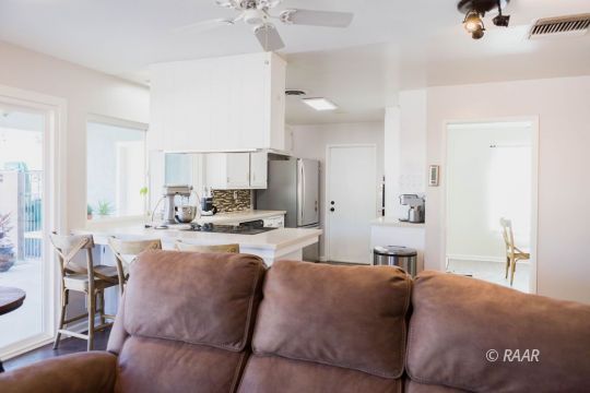730 Scott Circle Ridgecrest, CA 93555 - Photo 9 of 32 a living room with furniture and a chandelier