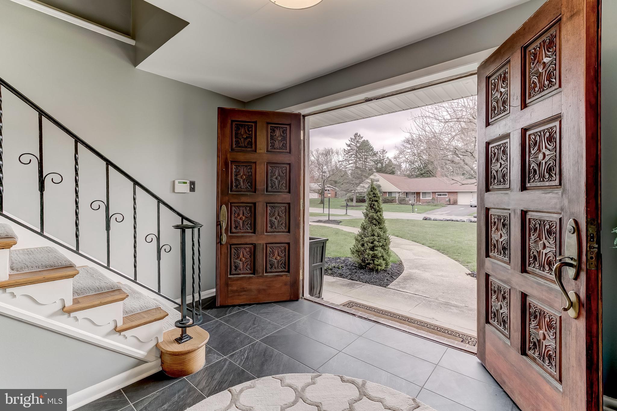 7928 Long Meadow Road Baltimore, MD 21208 - Photo 3 of 34 The welcoming foyer with decorative wood doors