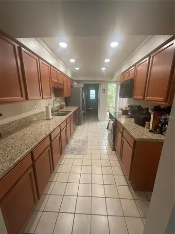 a utility room with cabinets washer and dryer