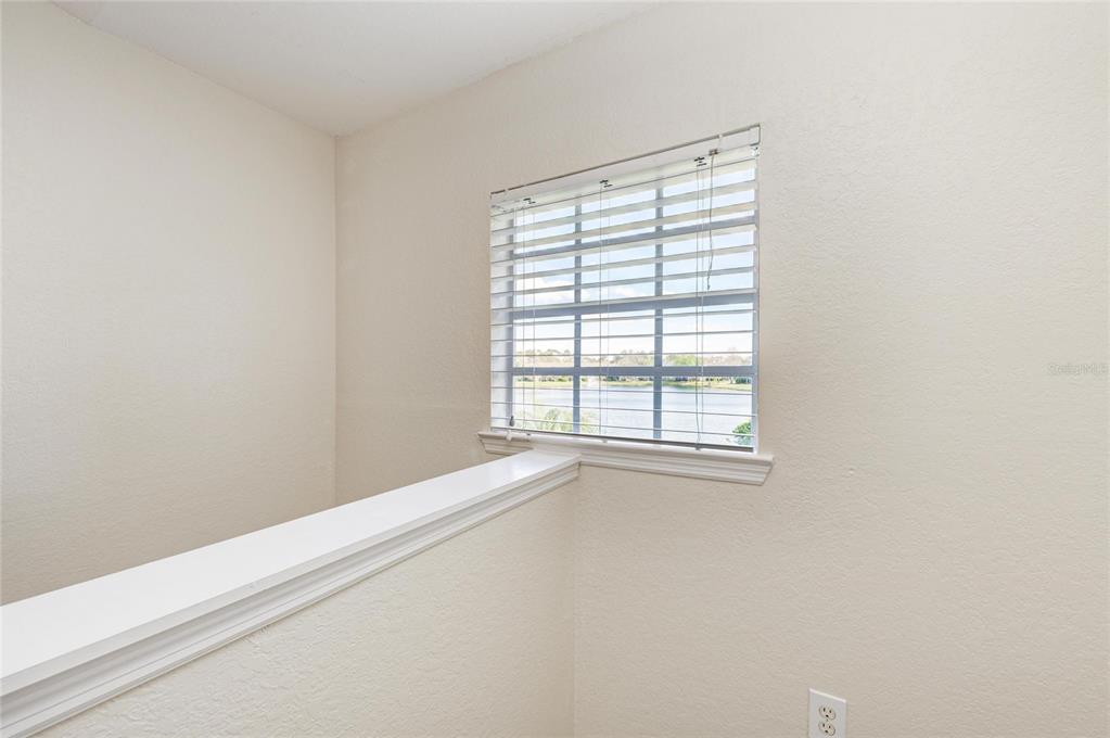 8911 Manor Loop, Unit 207 Lakewood Ranch, FL 34202 - Photo 17 of 71 a view of an empty room with a window