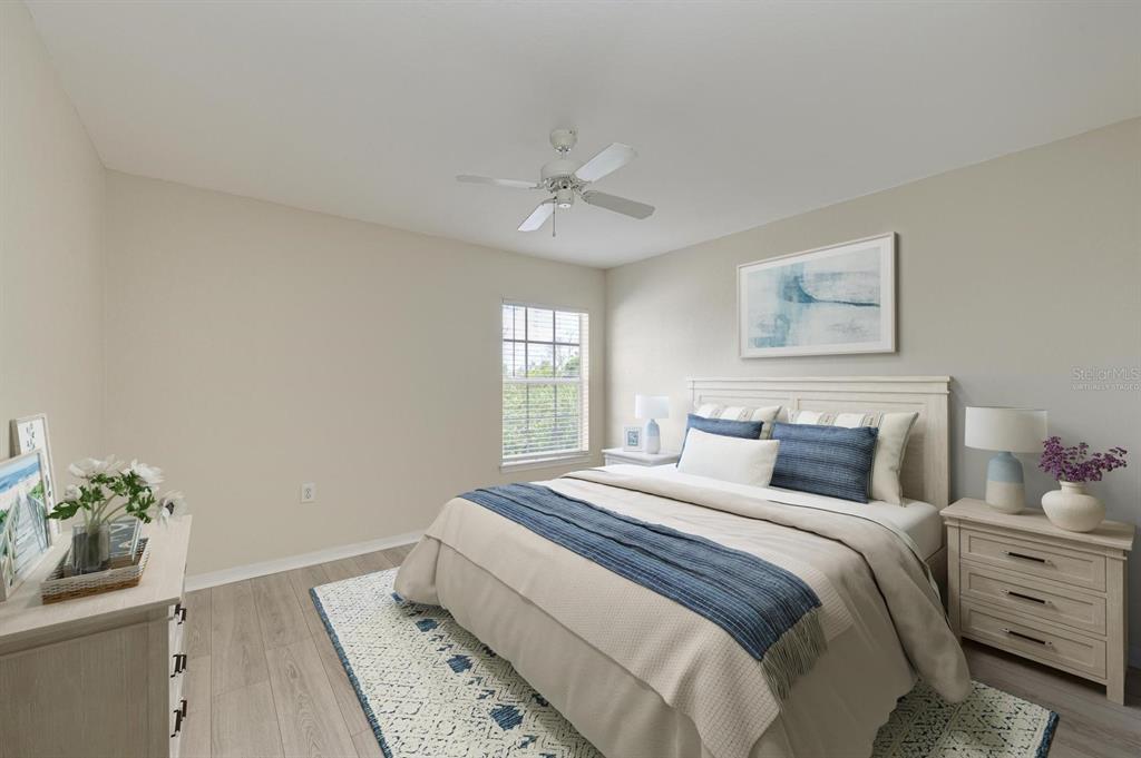 8911 Manor Loop, Unit 207 Lakewood Ranch, FL 34202 - Photo 33 of 71 a bedroom with a bed and a window