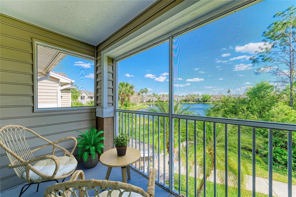 8911 Manor Loop, Unit 207 Lakewood Ranch, FL 34202 - Photo 43 of 71 a view of a porch with furniture and garden