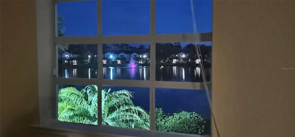 a view of a park with large trees