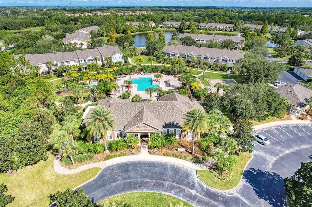8911 Manor Loop, Unit 207 Lakewood Ranch, FL 34202 - Photo 54 of 71 an aerial view of a house with a garden