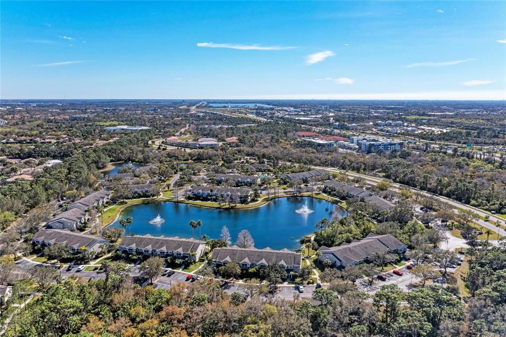 8911 Manor Loop, Unit 207 Lakewood Ranch, FL 34202 - Photo 63 of 71 an aerial view of a house with a yard