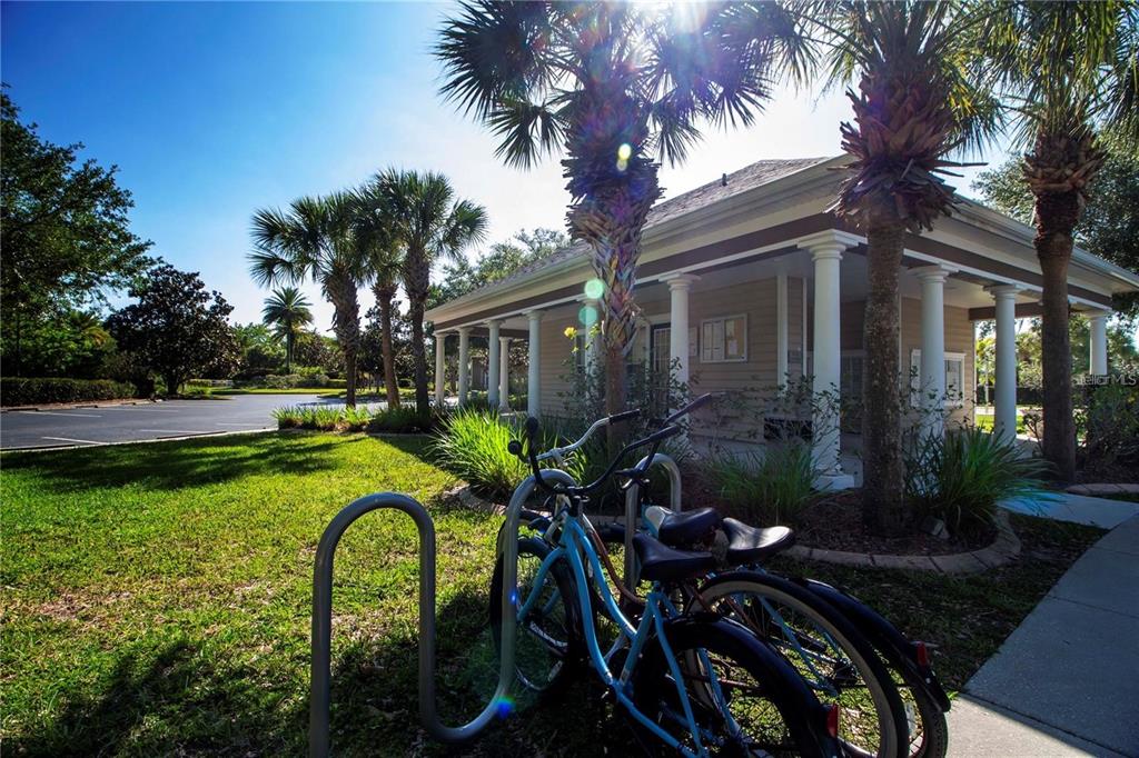 8911 Manor Loop, Unit 207 Lakewood Ranch, FL 34202 - Photo 66 of 71 a view of a house with backyard and sitting area