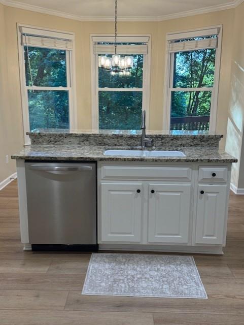 4055 Vista Point Lane Suwanee, GA 30024 - Photo 18 of 39 a kitchen with granite countertop a stove a sink and white cabinets with wooden floor