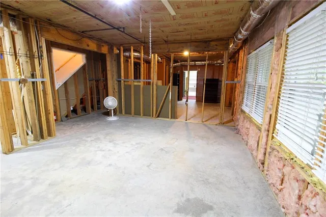 a view of empty room with wooden walls