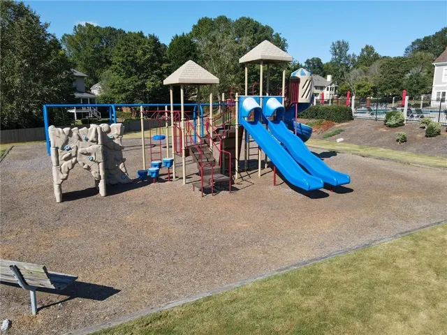 a view of a park with sitting area