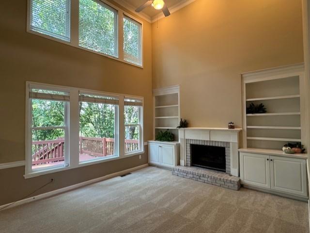 4055 Vista Point Lane Suwanee, GA 30024 - Photo 10 of 39 an empty room with furniture a fireplace and windows