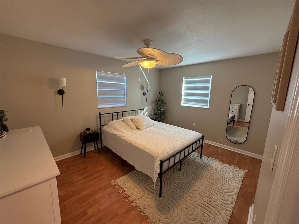 3066 19th Place Southwest Largo, FL 33774 - Photo 17 of 18 a bedroom with a bed and a table in it