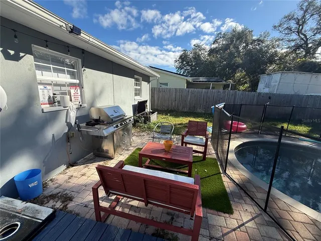 a outdoor space with patio couch and chairs